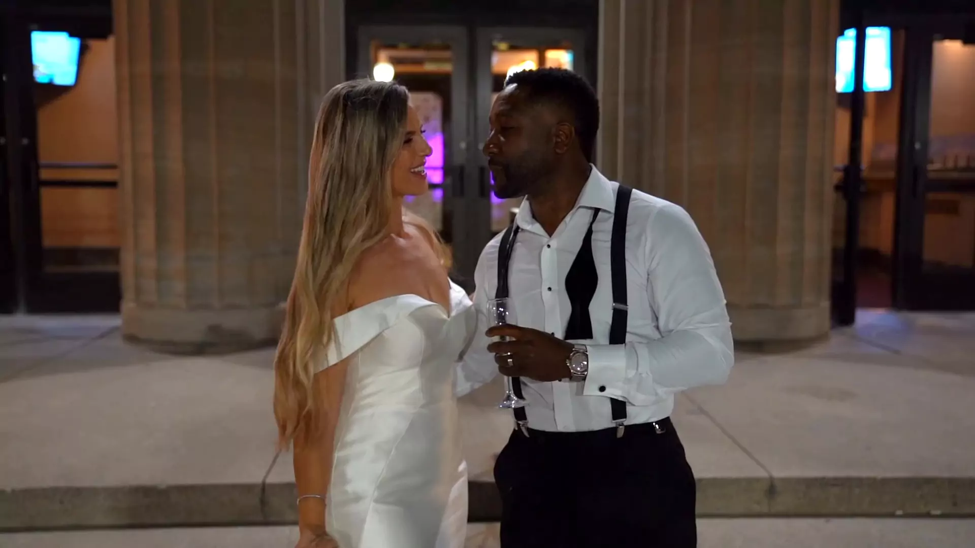 Annie & Knickoy standing outside of Liuna Station at the end of the night, enjoying a moment of peace and quiet, and a sip of champagne.
