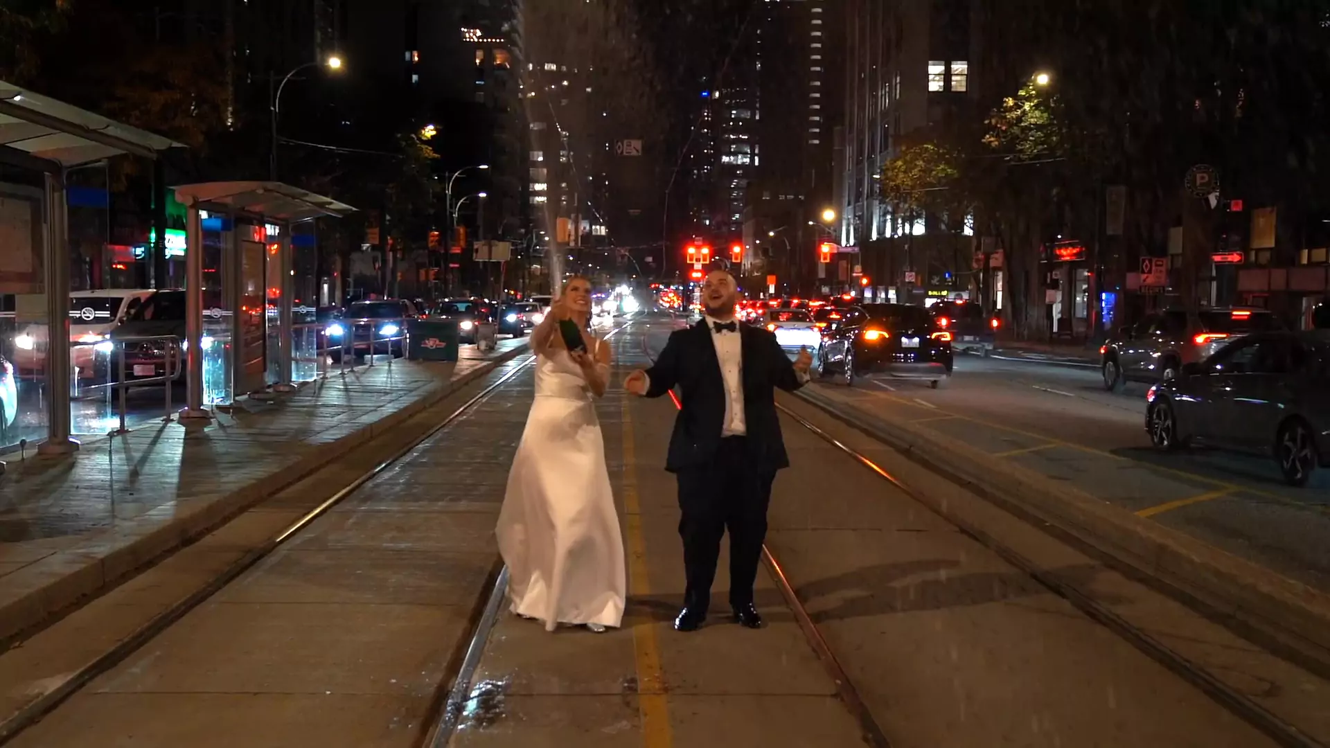 Kistina & Dan spraying champagne in the middle of Spadina Ave in Toronto.